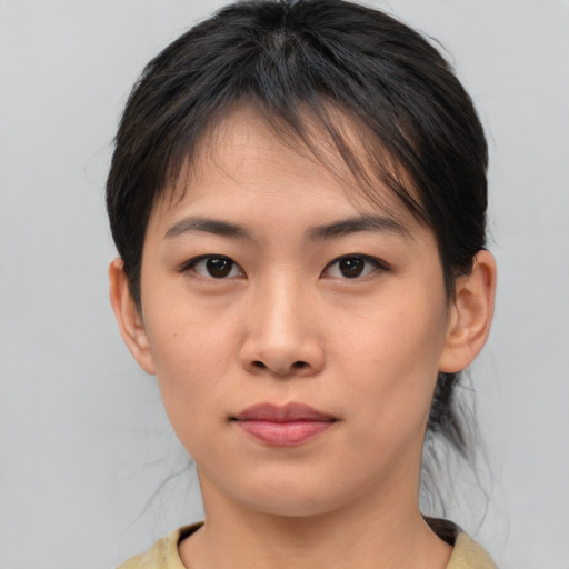 Neutral asian young-adult female with medium  brown hair and brown eyes