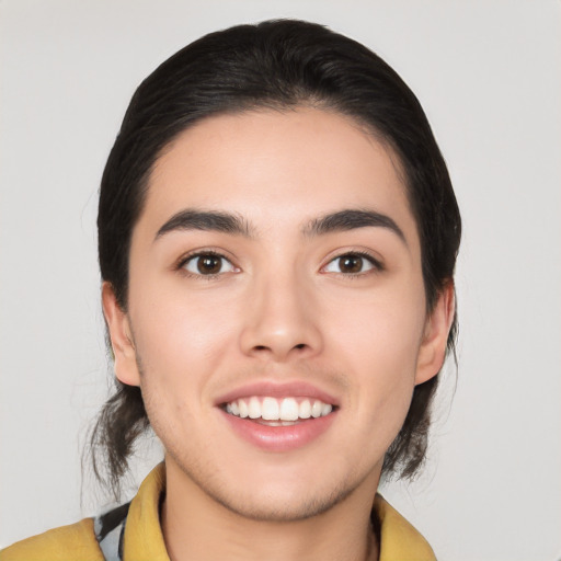 Joyful asian young-adult male with medium  black hair and brown eyes