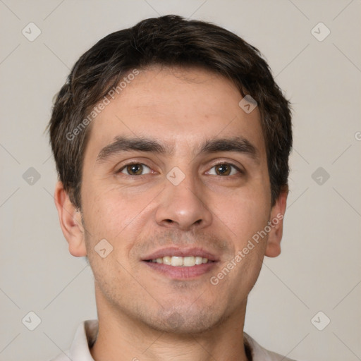 Joyful white young-adult male with short  brown hair and brown eyes