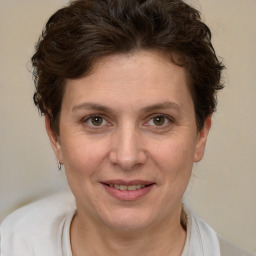 Joyful white adult female with short  brown hair and brown eyes