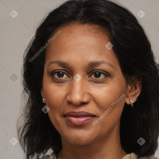 Joyful black adult female with medium  brown hair and brown eyes