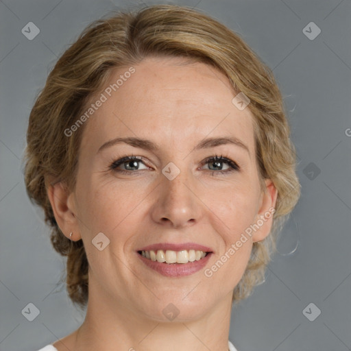 Joyful white adult female with medium  brown hair and blue eyes