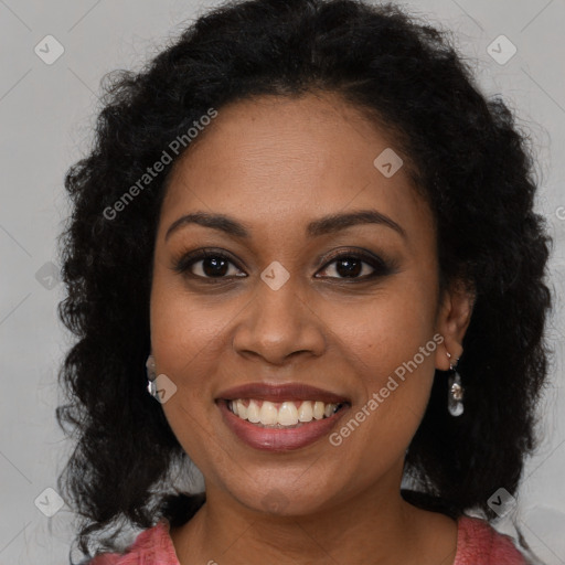 Joyful black young-adult female with long  brown hair and brown eyes