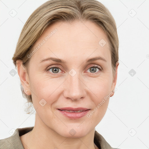 Joyful white adult female with medium  brown hair and blue eyes