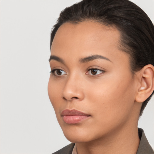 Neutral latino young-adult female with short  brown hair and brown eyes