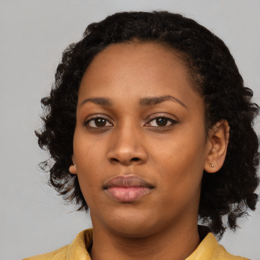 Neutral black young-adult female with medium  black hair and brown eyes