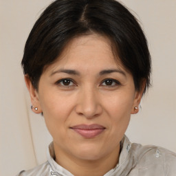 Joyful white adult female with medium  brown hair and brown eyes