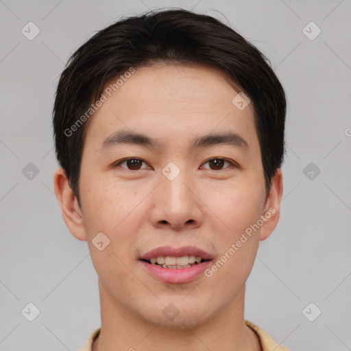 Joyful asian young-adult male with short  brown hair and brown eyes