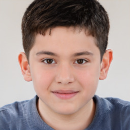 Joyful white child male with short  brown hair and brown eyes