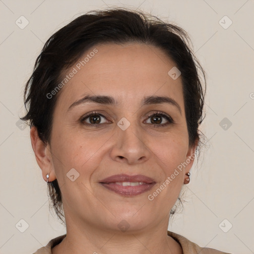 Joyful white adult female with medium  brown hair and brown eyes