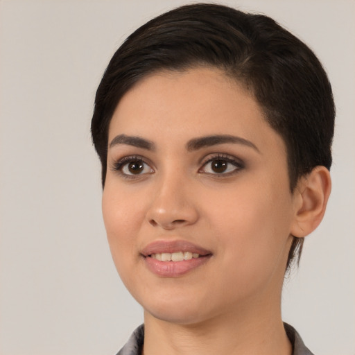 Joyful white young-adult female with medium  black hair and brown eyes