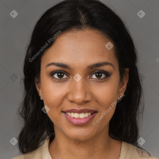 Joyful black young-adult female with long  brown hair and brown eyes