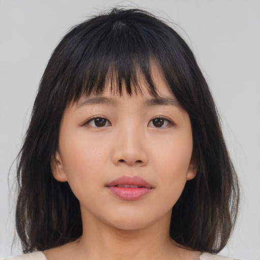 Neutral asian young-adult female with medium  brown hair and brown eyes