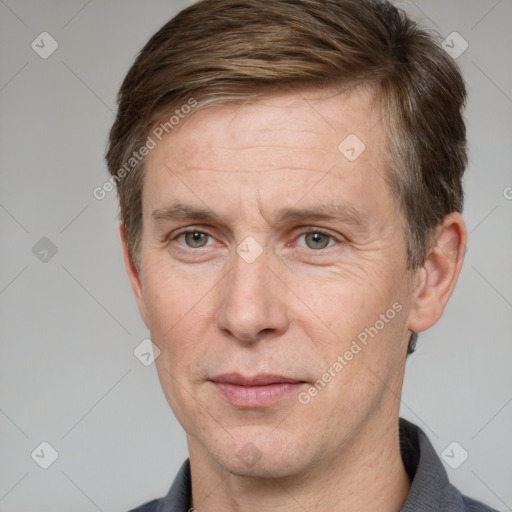 Joyful white adult male with short  brown hair and grey eyes