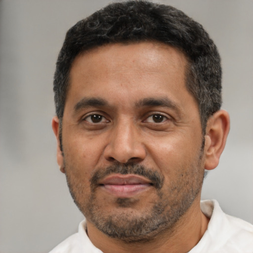 Neutral black adult male with short  black hair and brown eyes