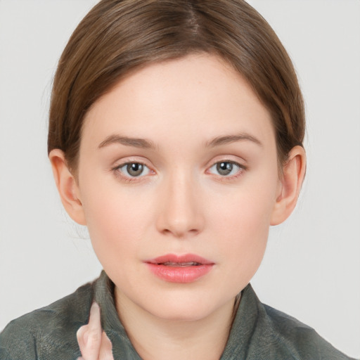 Neutral white young-adult female with long  brown hair and grey eyes