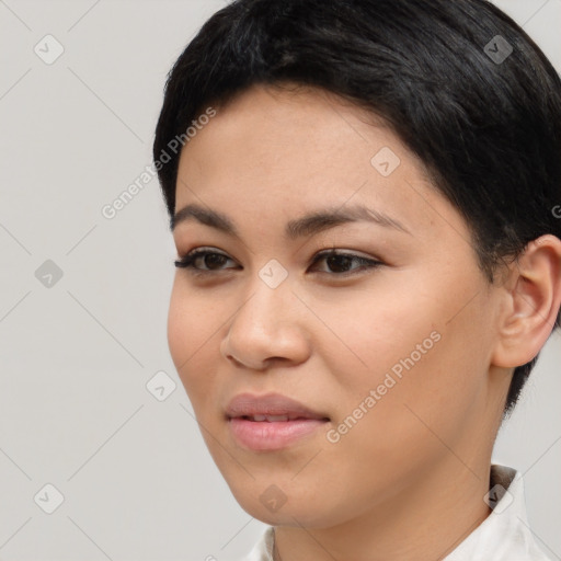 Joyful latino young-adult female with short  brown hair and brown eyes