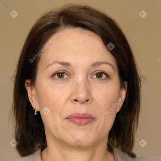 Joyful white adult female with medium  brown hair and brown eyes