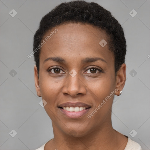 Joyful black young-adult female with short  black hair and brown eyes