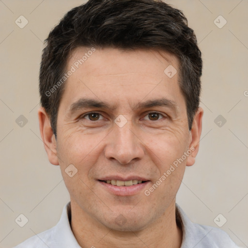 Joyful white adult male with short  brown hair and brown eyes