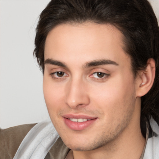 Joyful white young-adult male with medium  brown hair and brown eyes