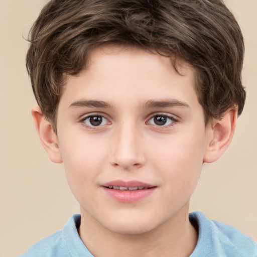 Joyful white child male with short  brown hair and brown eyes