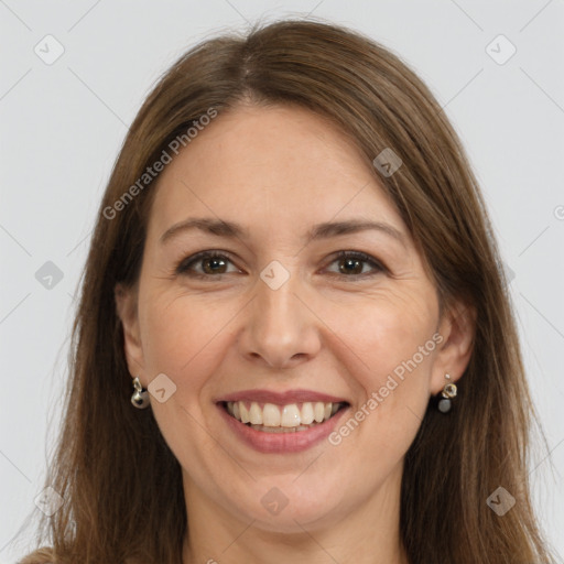 Joyful white adult female with long  brown hair and brown eyes