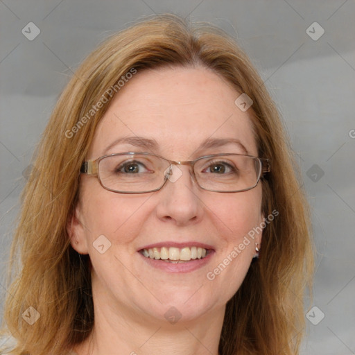 Joyful white adult female with medium  brown hair and blue eyes