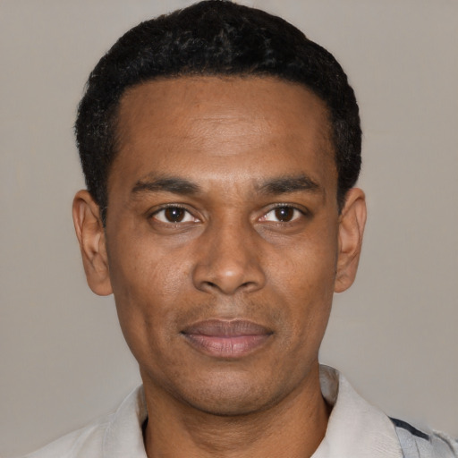 Neutral black young-adult male with short  black hair and brown eyes