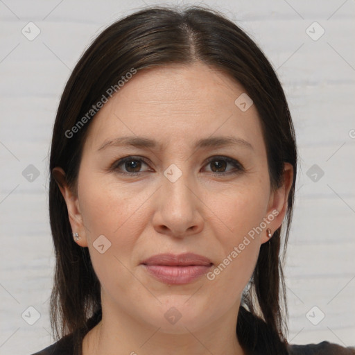 Joyful white adult female with medium  brown hair and brown eyes