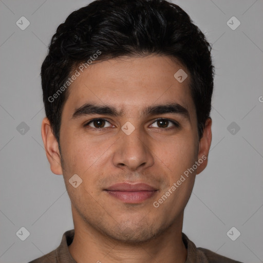 Joyful white young-adult male with short  black hair and brown eyes