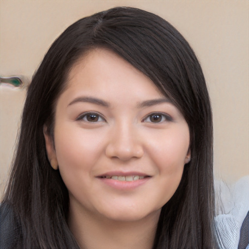 Joyful white young-adult female with long  black hair and brown eyes