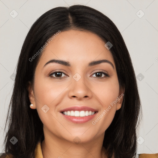 Joyful latino young-adult female with long  black hair and brown eyes