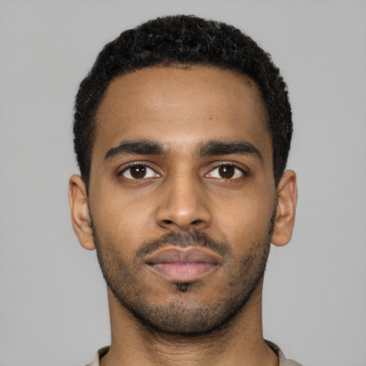 Neutral black young-adult male with short  black hair and brown eyes