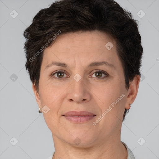 Joyful white adult female with short  brown hair and brown eyes