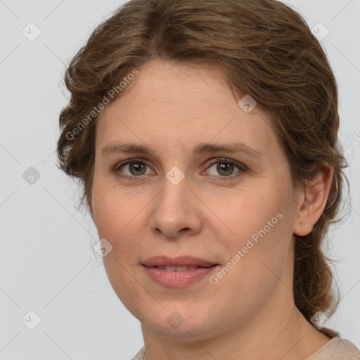 Joyful white young-adult female with medium  brown hair and green eyes