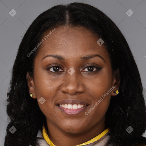Joyful black young-adult female with long  brown hair and brown eyes