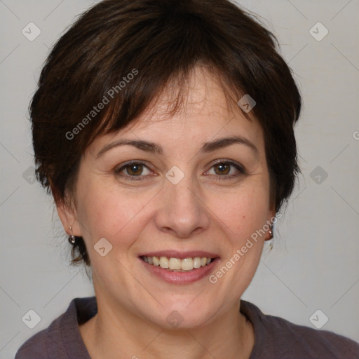 Joyful white adult female with medium  brown hair and brown eyes