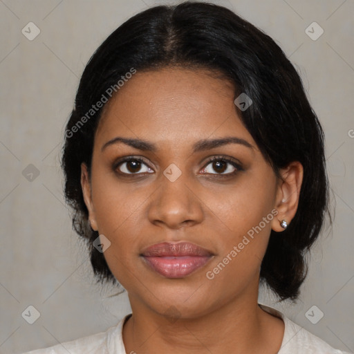 Joyful black young-adult female with medium  black hair and brown eyes