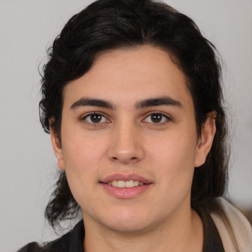 Joyful white young-adult male with medium  brown hair and brown eyes