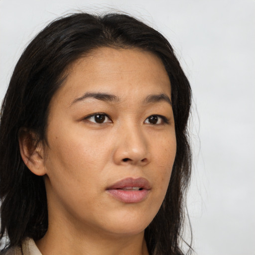Neutral asian young-adult female with medium  brown hair and brown eyes