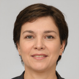 Joyful white adult female with short  brown hair and grey eyes