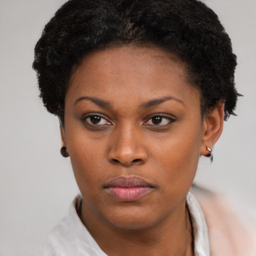Neutral black young-adult female with short  brown hair and brown eyes