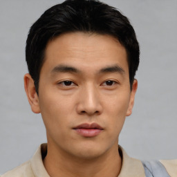 Neutral asian young-adult male with short  brown hair and brown eyes