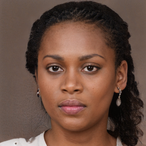 Neutral black young-adult female with long  black hair and brown eyes