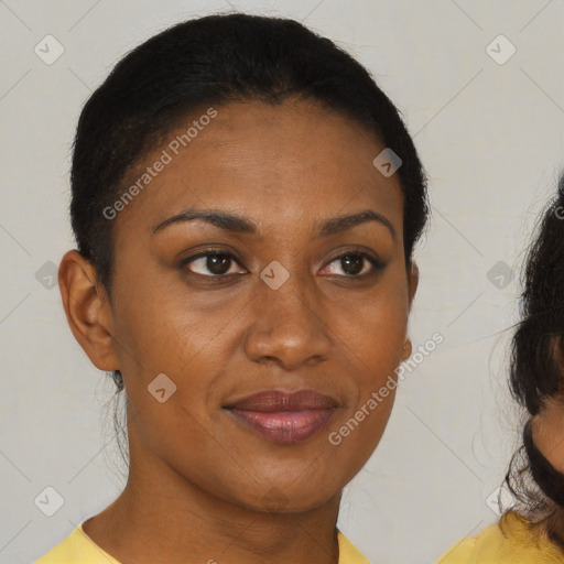 Joyful black young-adult female with short  brown hair and brown eyes