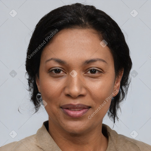 Joyful black adult female with short  black hair and brown eyes