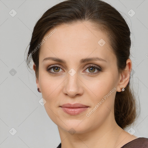 Joyful white young-adult female with medium  brown hair and grey eyes