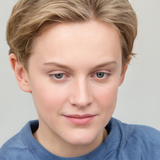 Joyful white young-adult female with short  brown hair and blue eyes