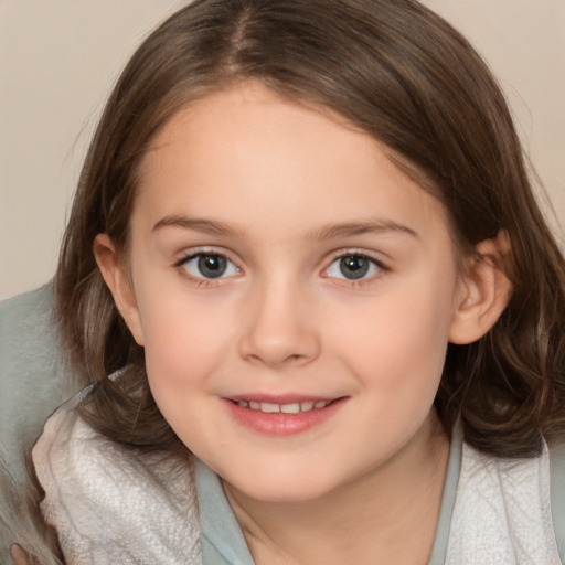 Joyful white child female with medium  brown hair and brown eyes